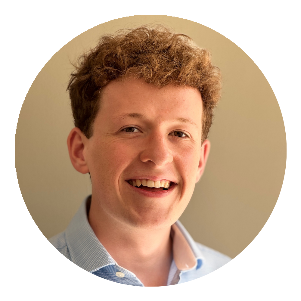 A professional headshot of Luke Handley